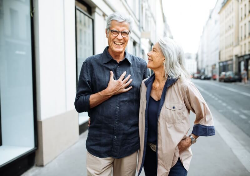 Elderly couple walking in the street