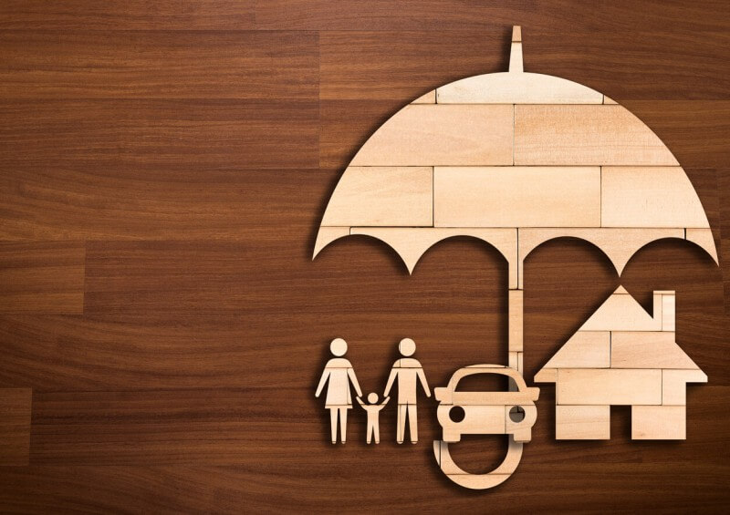 Family car and house under umbrella