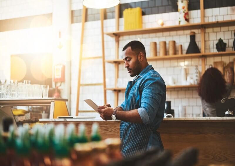 Self employed man working in his restaurant